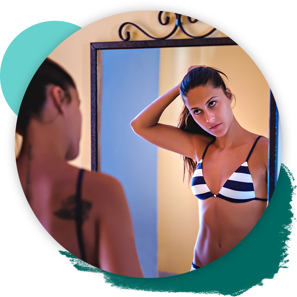 img 2 woman in front of mirror in bikini