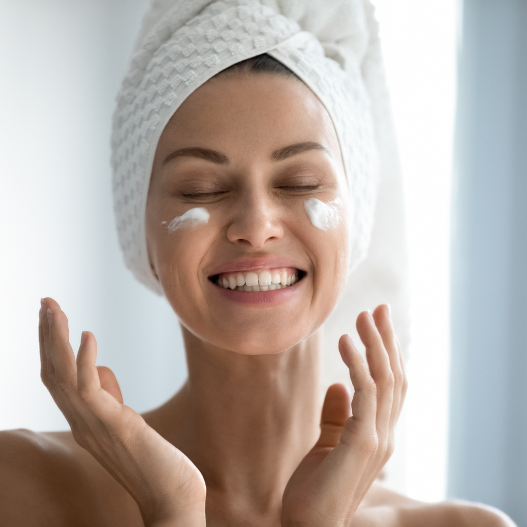woman applying skin care product