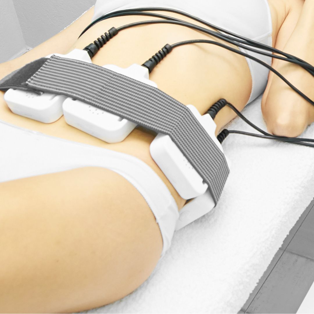 person using body sculpting treatment