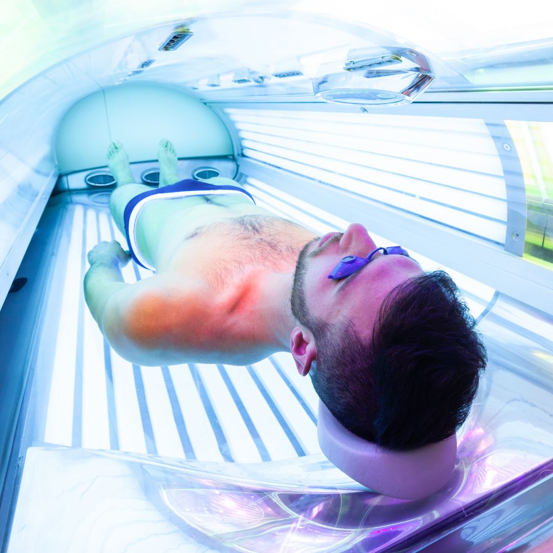 man in uv tanning bed