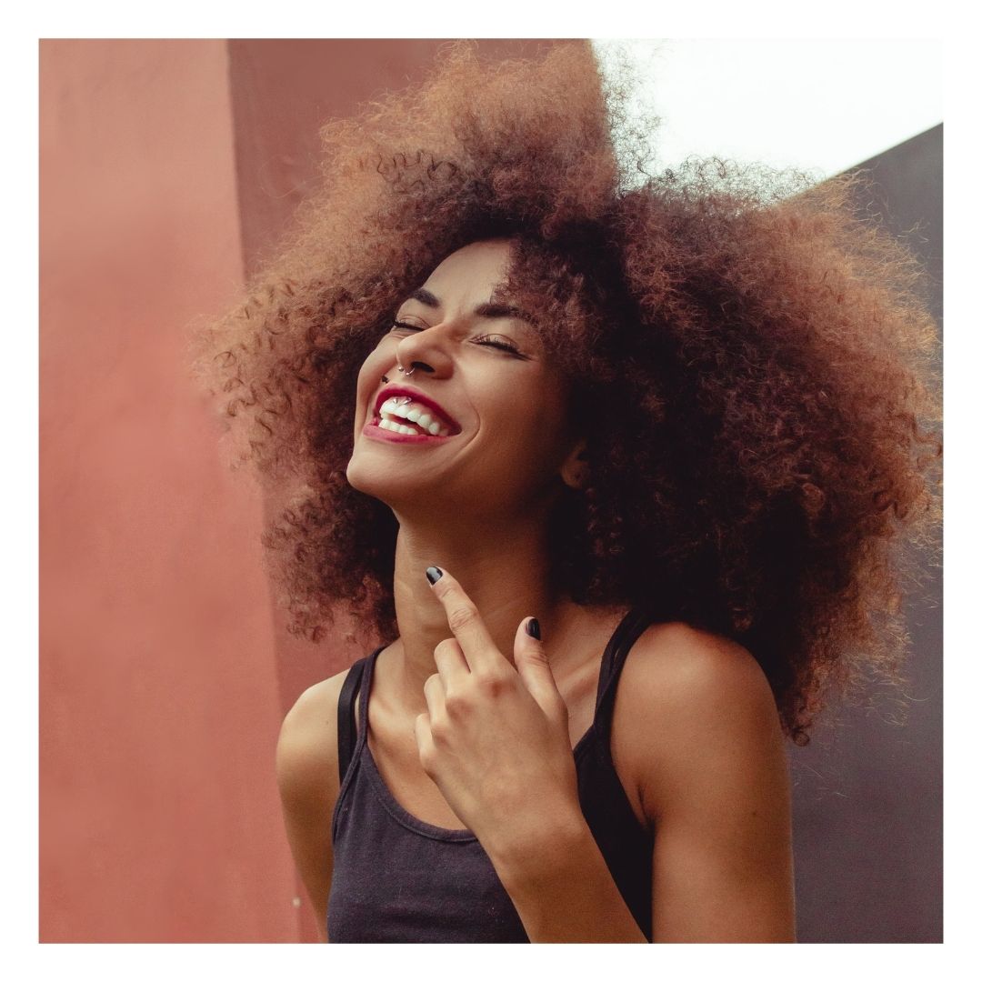 woman with youthful skin laughing