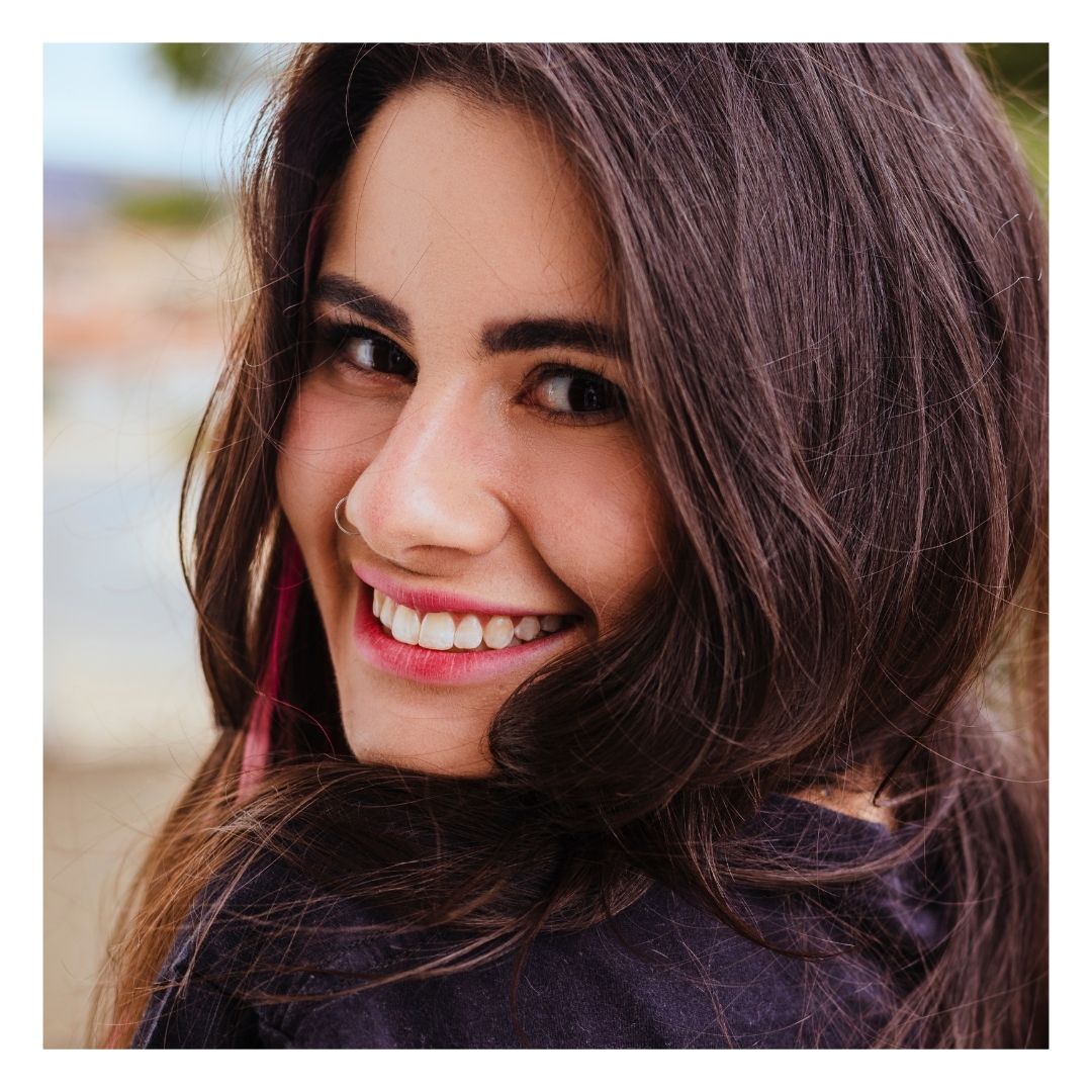 tan woman smiling