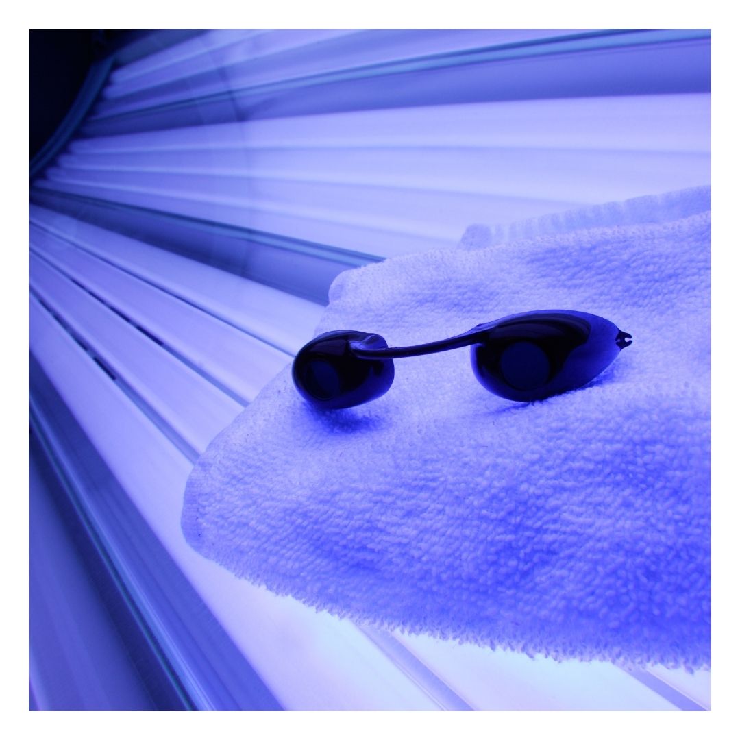 tanning bed with a towel and protective eyewear