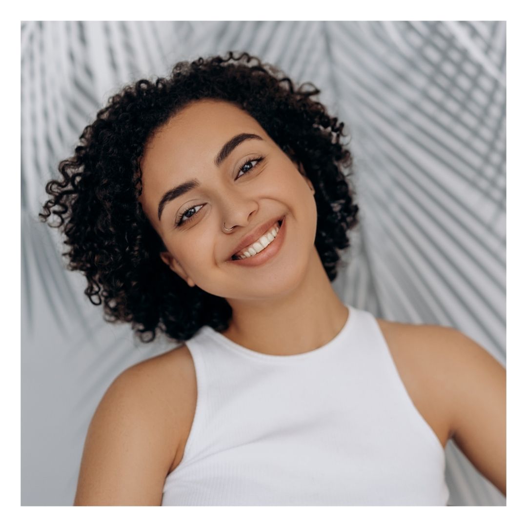 woman smiling with youthful skin